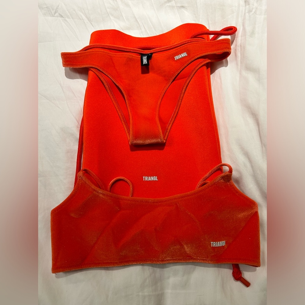 Triangl pre owned
